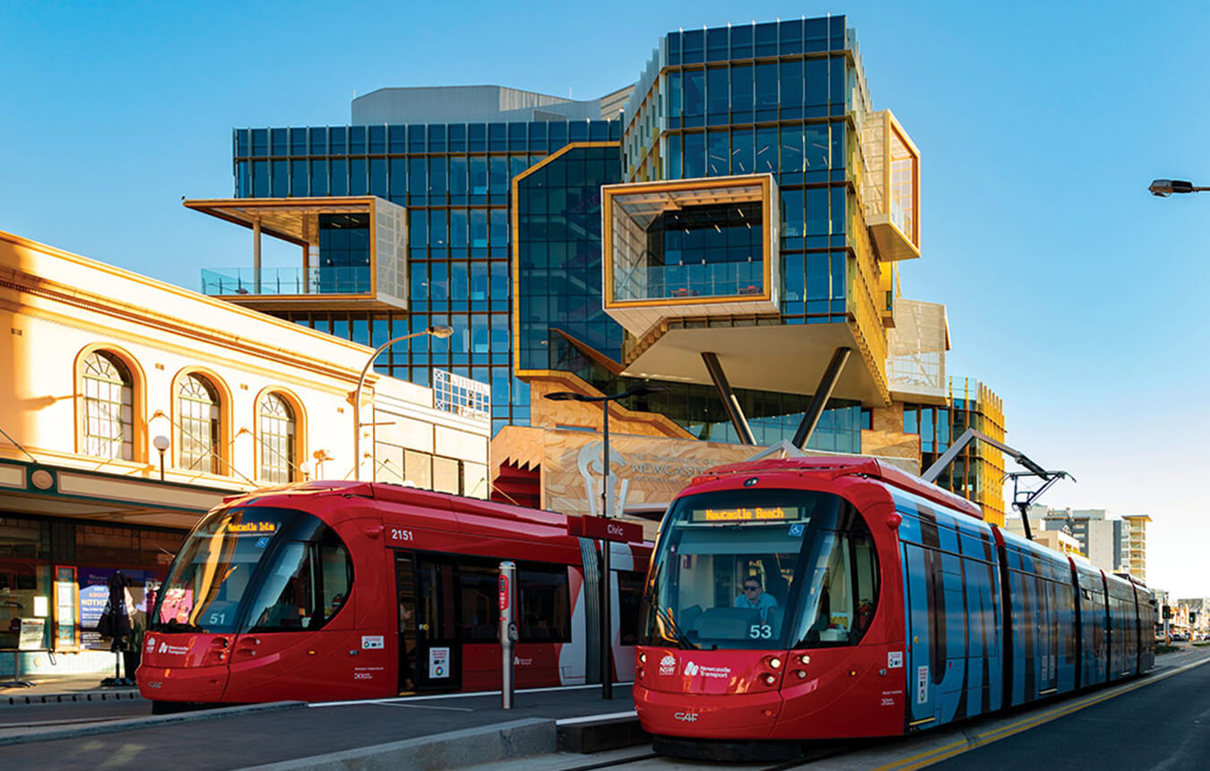 Newcastle light rail passing the UON NUspace Building